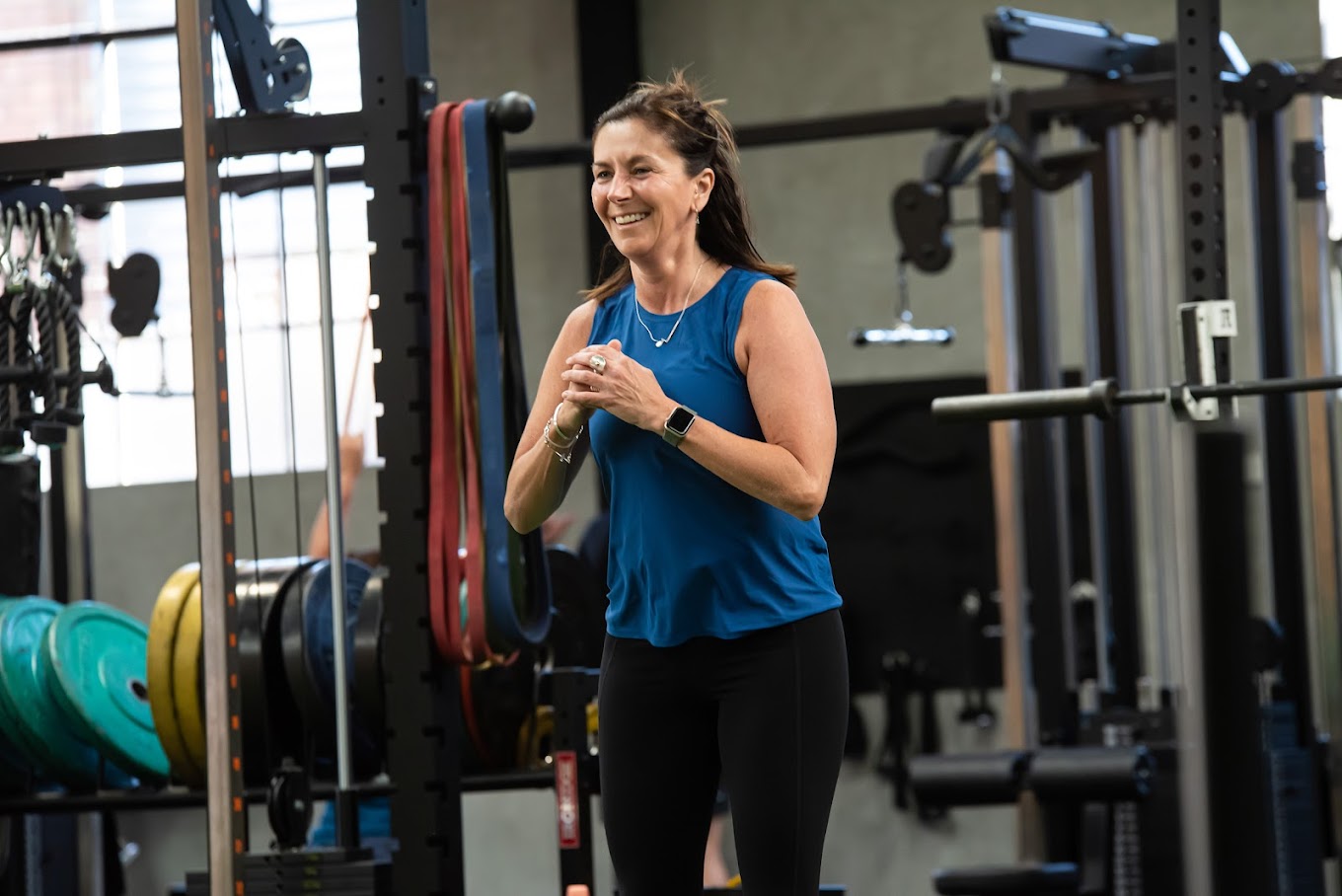 A smiling member during a training session at The Fit Shop