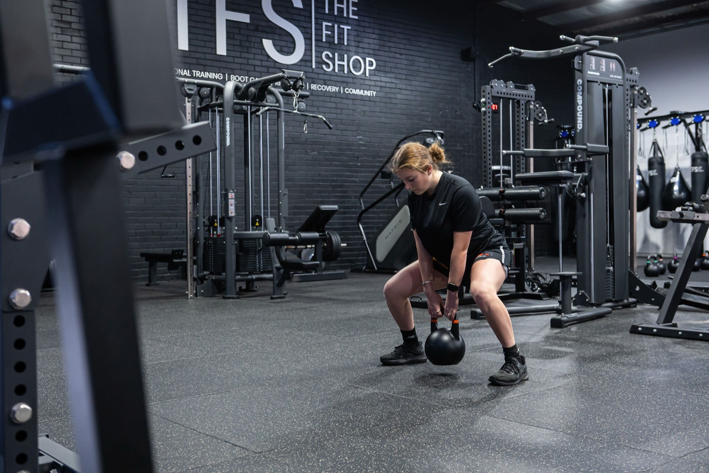 A member training with a kettlebell in the gym